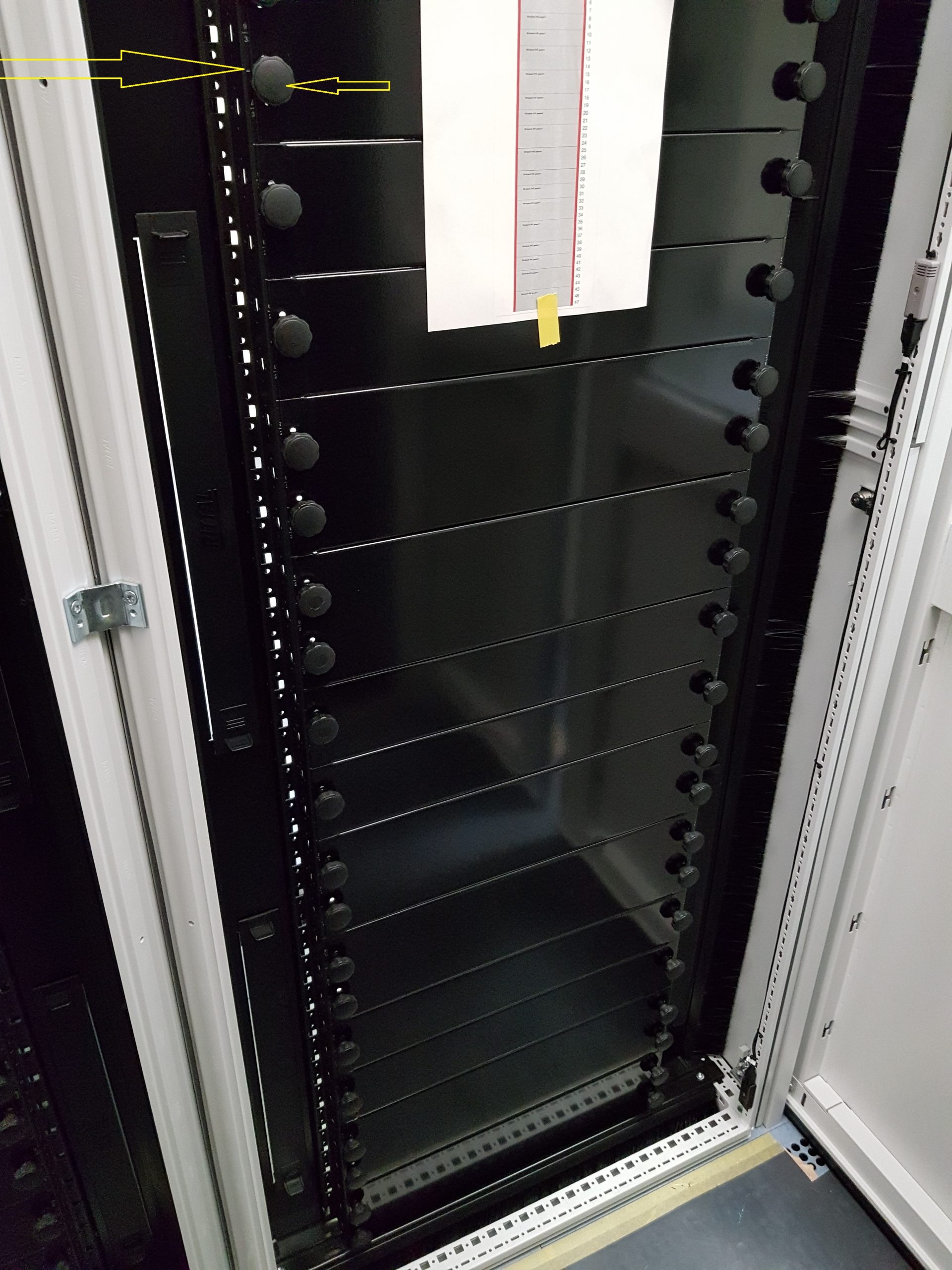 a black metal box with many knobs